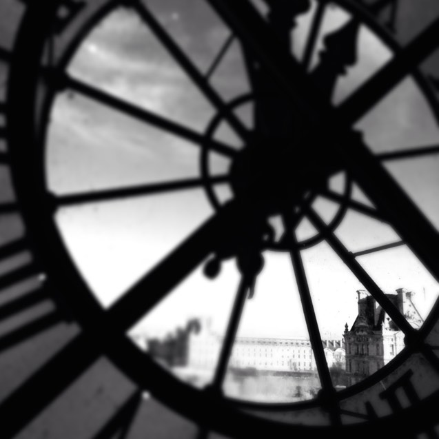 Louvre Musuem, as seen through the Musee d'Orsay Clock